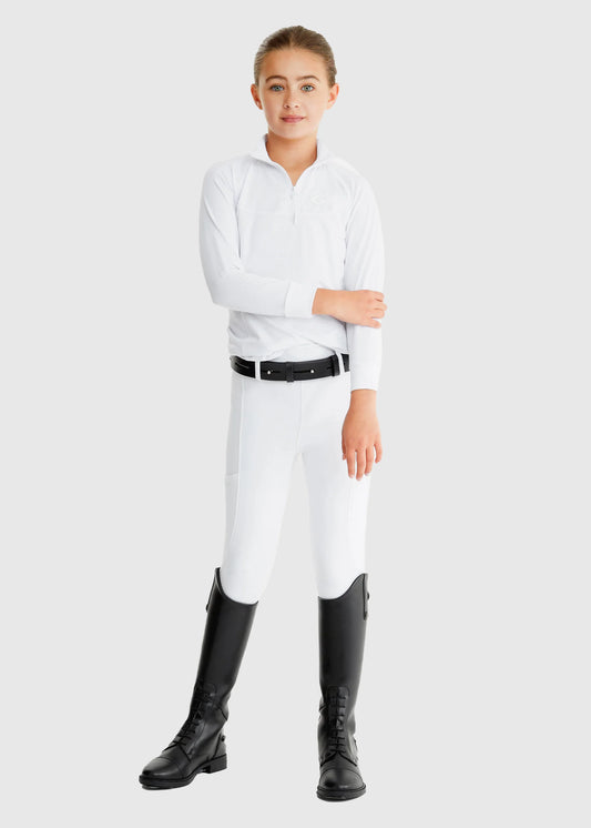 Person wearing a white equestrian shirt, white pants, and black riding boots on a light gray background