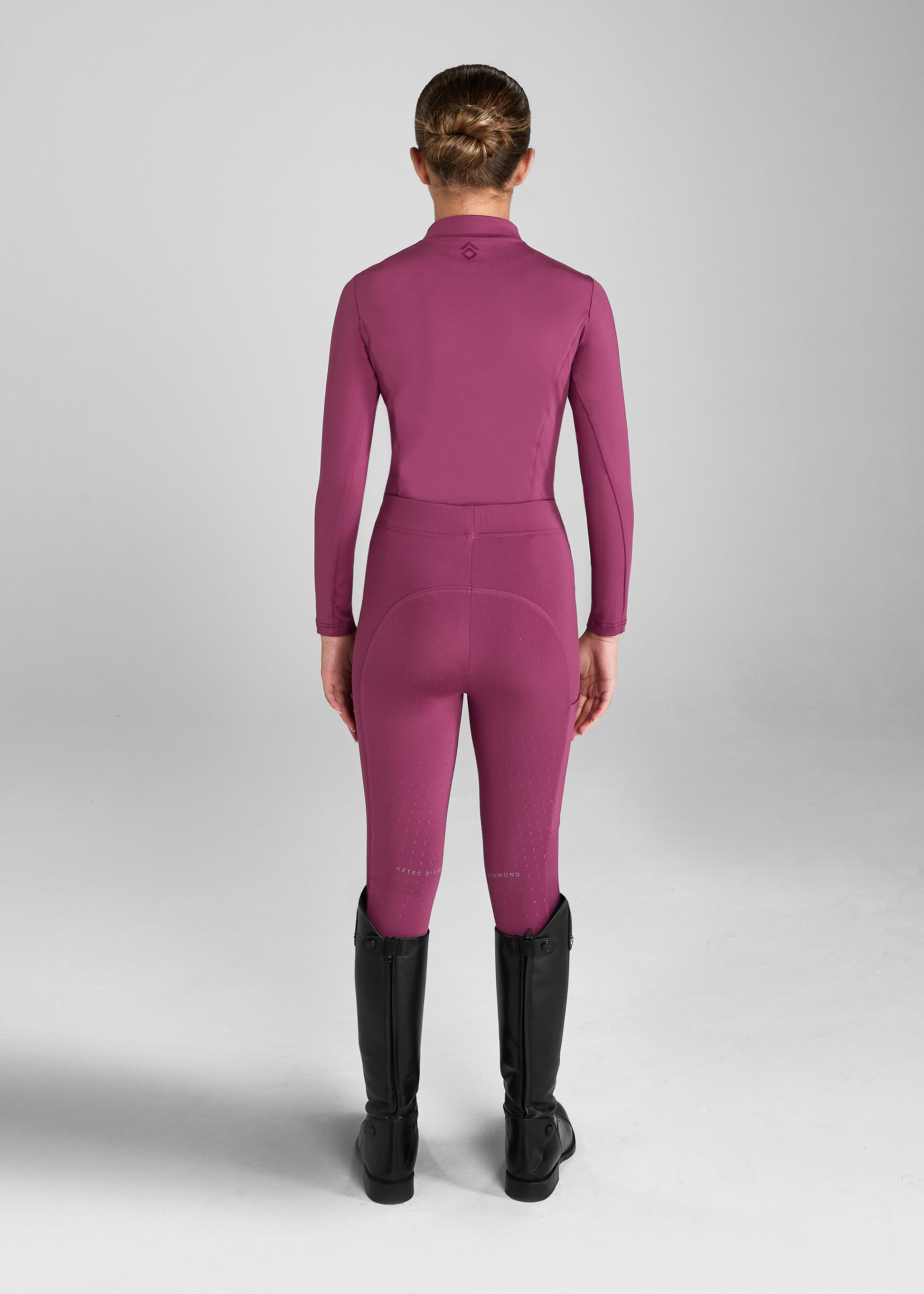 Aztec Diamond Riding Leggings:
“Aztec Diamond riding leggings featuring high-stretch fabric, supportive waistband, and sleek side pocket design”
“Detail of Aztec Diamond riding leggings showing reinforced knee patches and subtle logo branding”
“Pair of Aztec Diamond riding leggings displayed flat, highlighting contoured seams and technical performance material”
